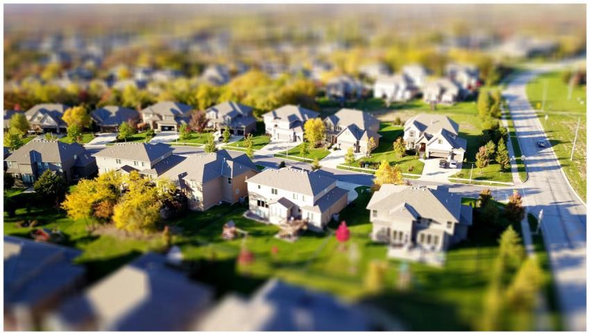 Tilt-shift aerial photo of a suburban neighborhood