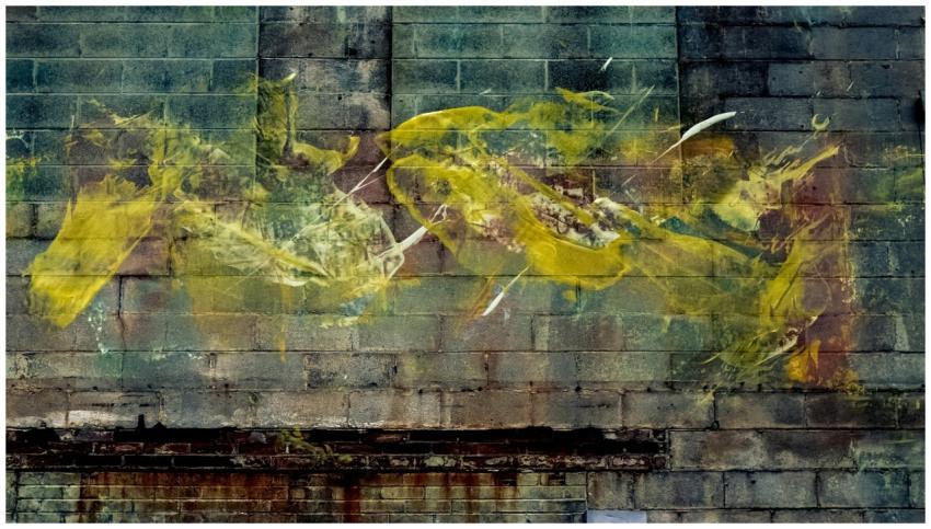 Vibrant graffiti art on a weathered brick wall, sh