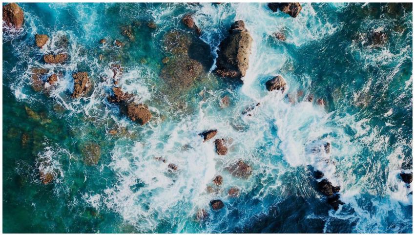 Stunning aerial view of ocean waves crashing again