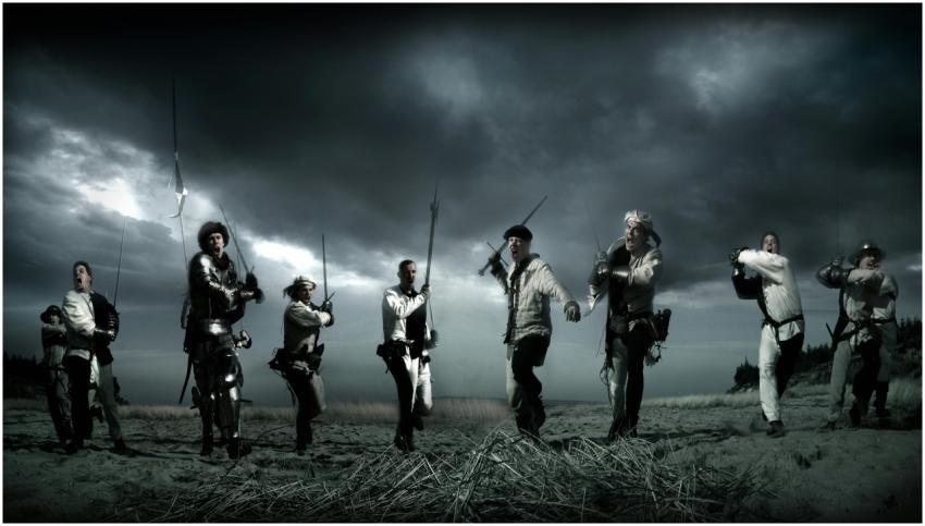 Dramatic scene of medieval knights charging in a r