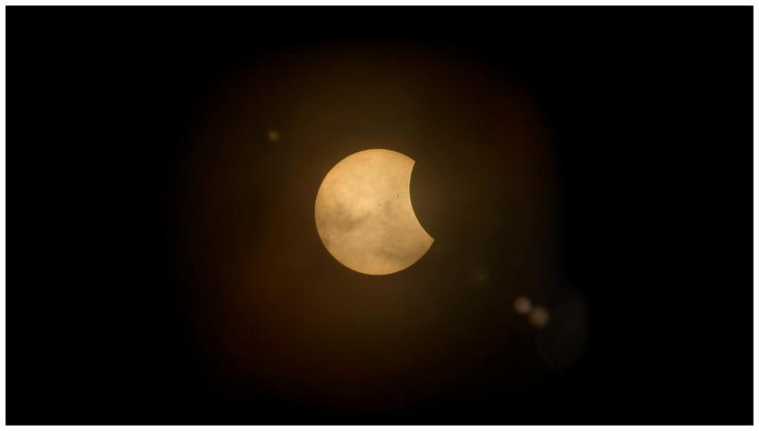 Captured partial solar eclipse set against a deep