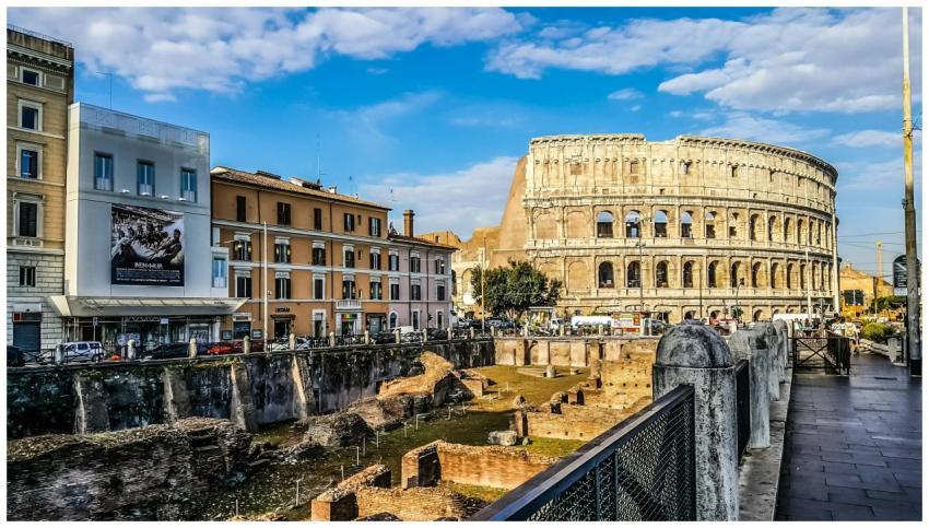 Daylight view of the historic Colosseum in Rome wi