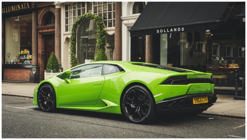 A vibrant lime green Lamborghini parked on a Londo