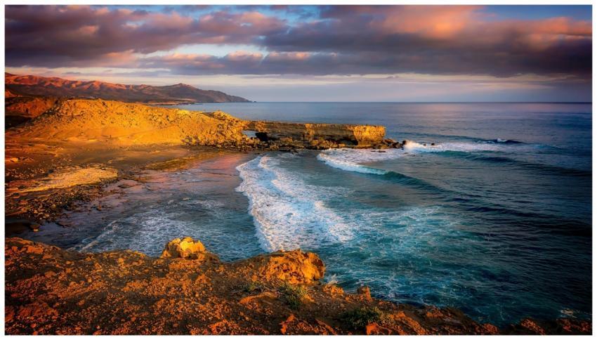 Captivating view of ocean waves crashing on rugged