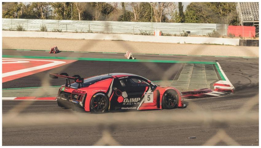 Close-up of a red sports car racing on an outdoor