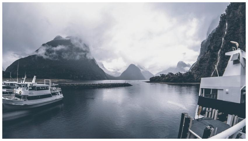 A misty view of Milford Sound, Southland, with boa