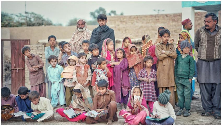 A diverse group of children and adults engaged in