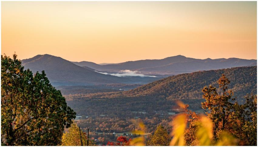 A stunning landscape of mountains during a colorfu