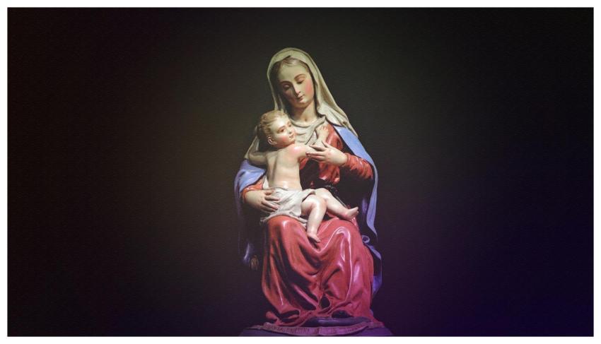 A beautifully crafted statue depicting Mary holdin