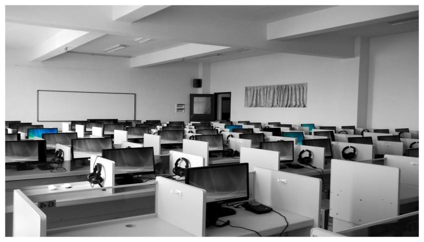 A spacious, empty call center office with rows of