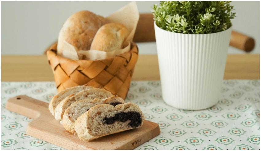 A selection of wheat breads on a wooden board with
