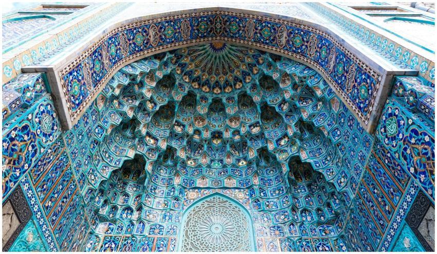 A close-up view of an ornate Islamic dome with vib