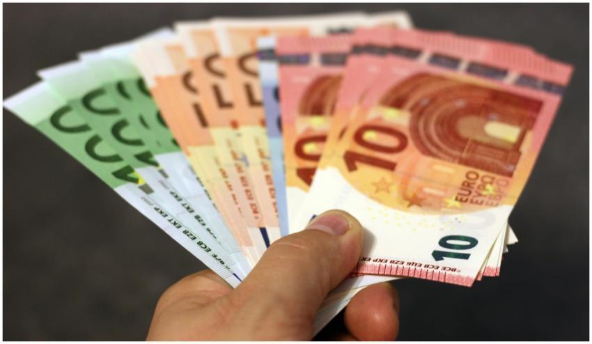 A fan of euro banknotes in various denominations h