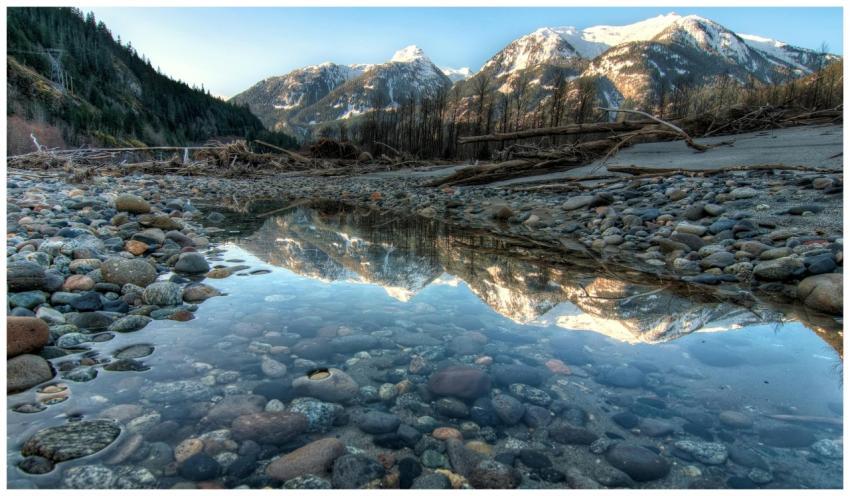 Tranquil winter scene with snow-capped mountains r