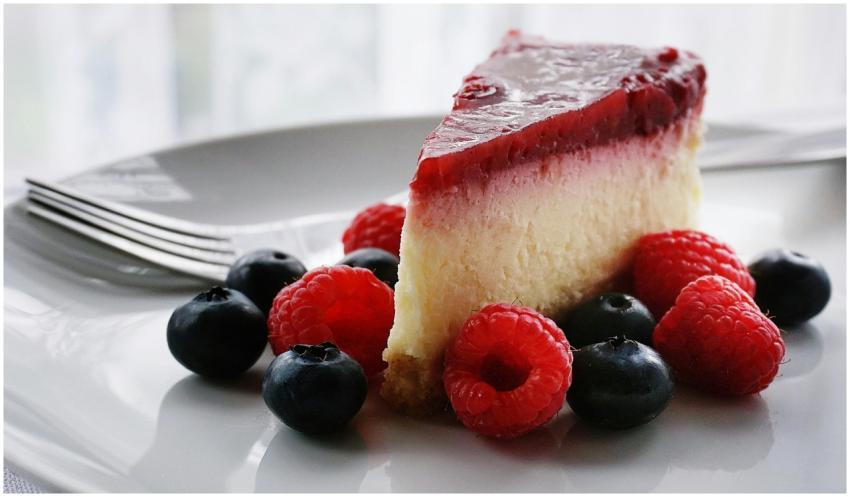 A tempting slice of cheesecake topped with berries