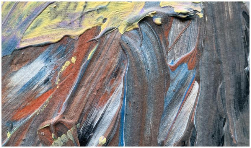 A close-up view of vibrant acrylic paint textures