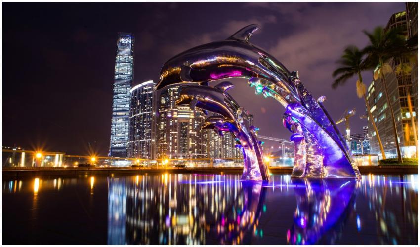 Dramatic cityscape at night featuring illuminated