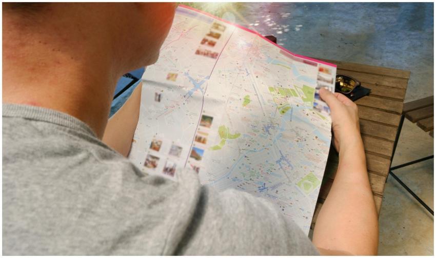 Traveler studying a map for directions, symbolizin