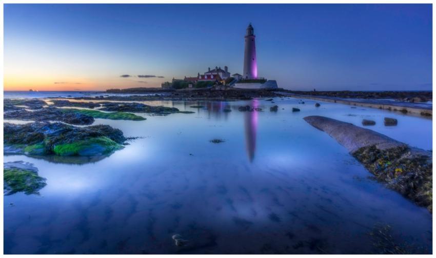 Serene twilight seascape featuring St. Mary's ligh
