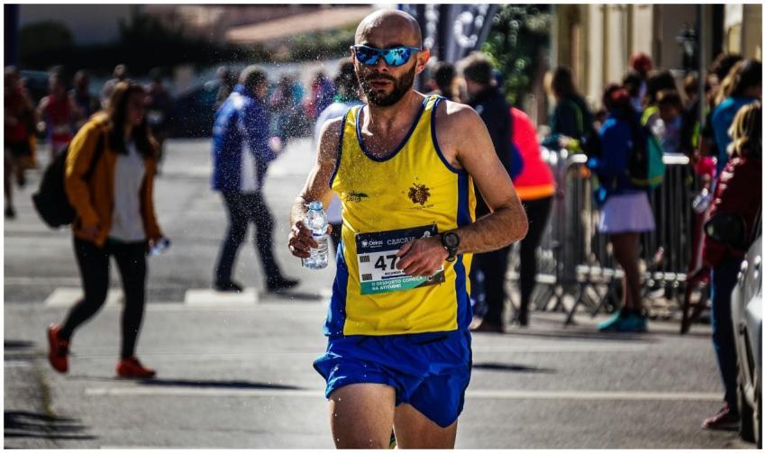 Determined runner in colorful attire participating
