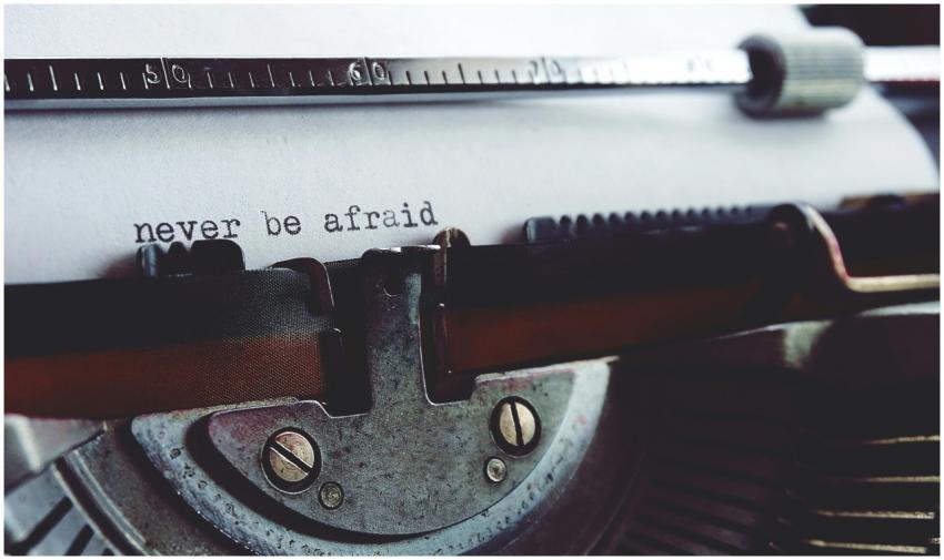 Close-up of a vintage typewriter with the message
