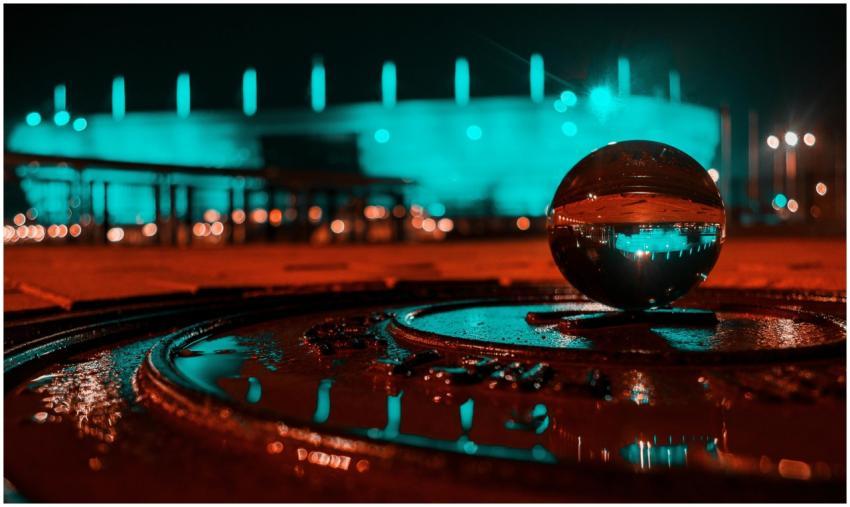 Artistic night cityscape featuring a glowing glass