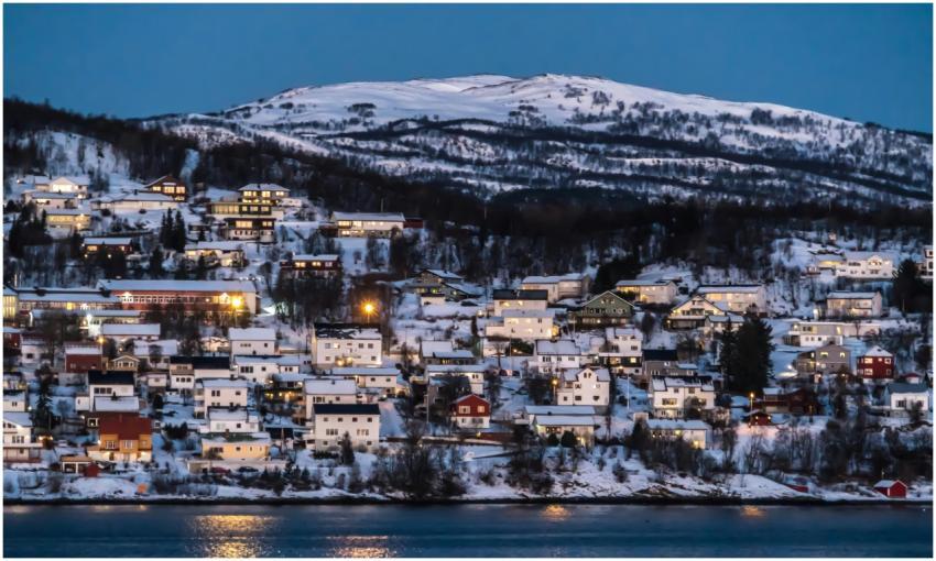 Charming snowy village set against Norwegian winte