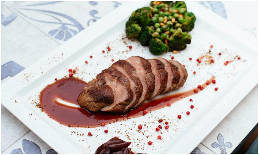 Deliciously plated duck breast with broccoli and s