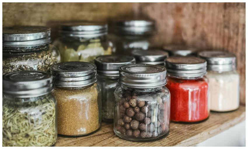 Close-up of assorted spice jars with various herbs