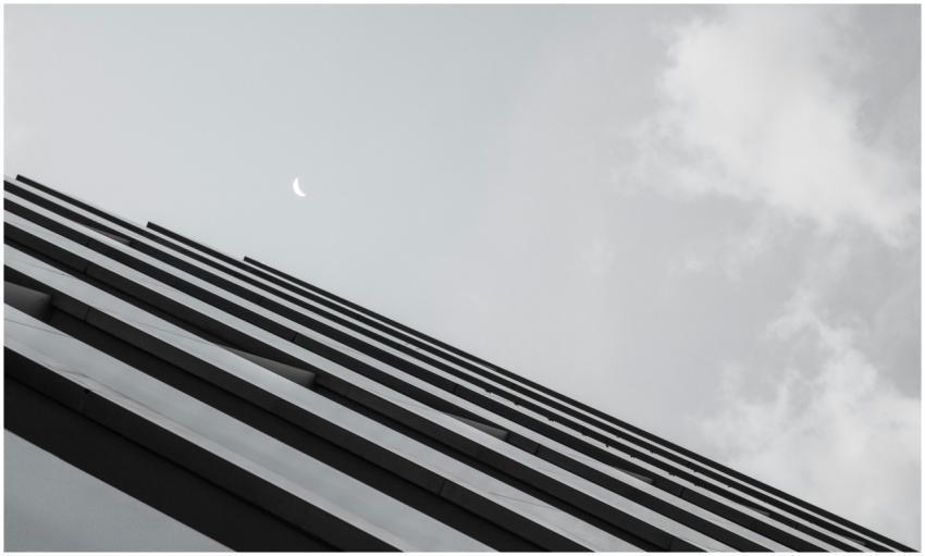 A low angle view of a modern skyscraper against a