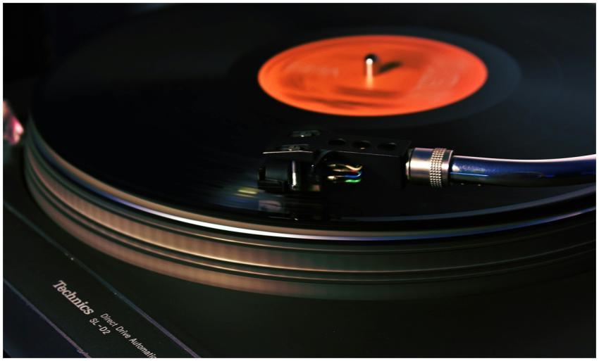 Close-up image of a vintage turntable playing a vi