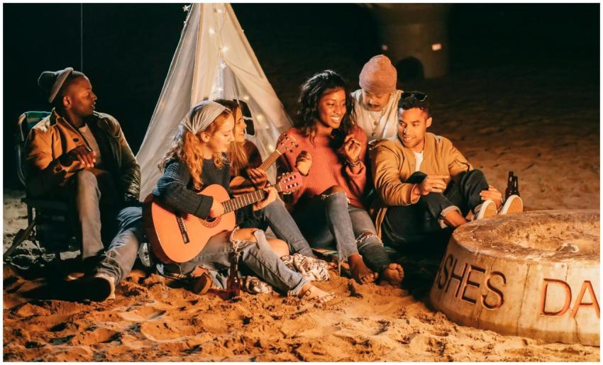 Group of friends enjoying music and socializing by