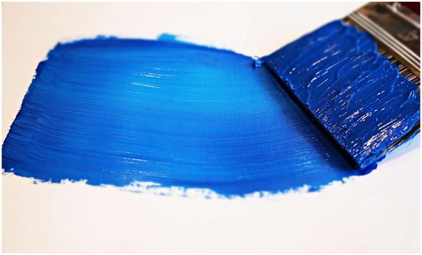 Close-up of a vivid blue brushstroke applied to a