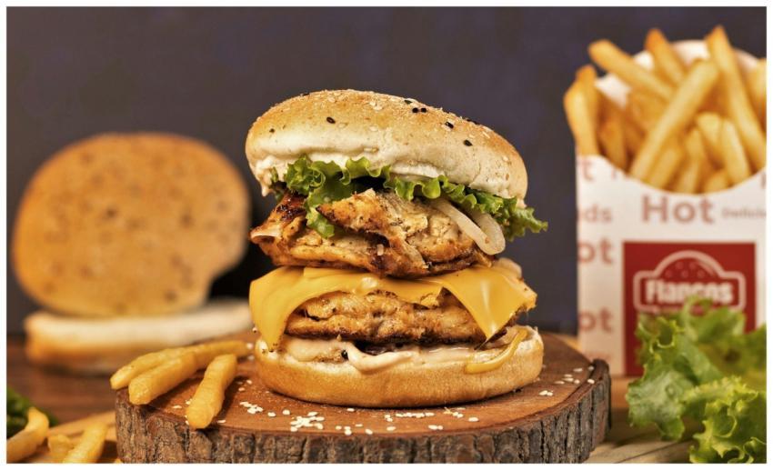 Succulent double cheeseburger with lettuce and fri