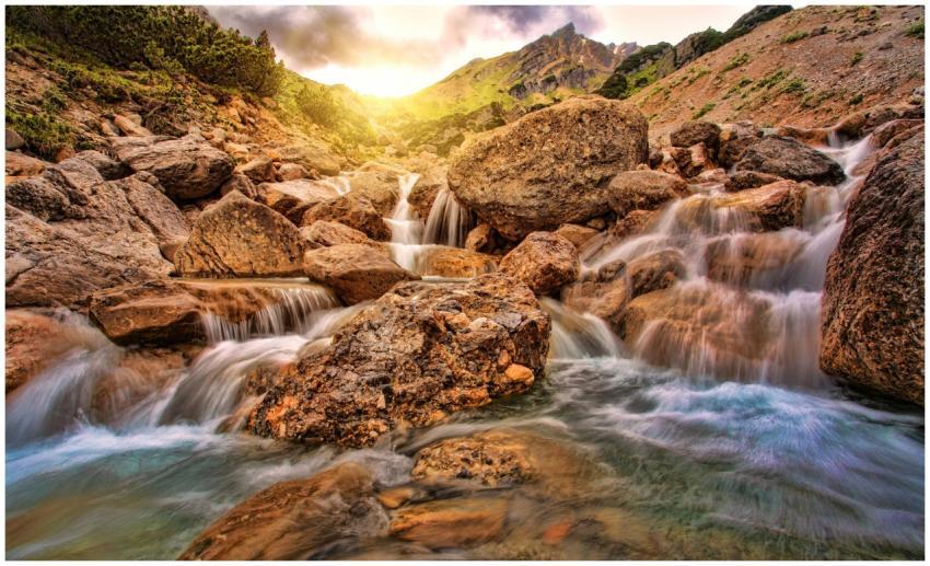 Captivating mountain stream flowing over rocks und