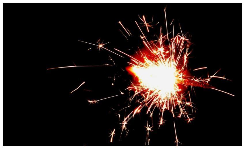 Vivid sparkler burst captured against a dark backd