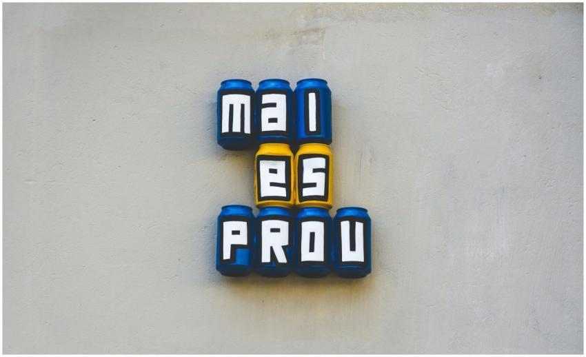 Creative wall art featuring cans spelling out word