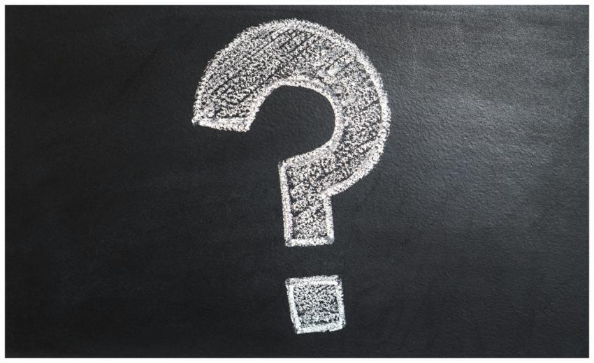 A conceptual image featuring a question mark drawn