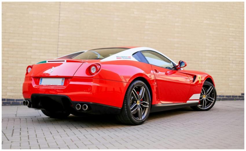 Rear view of a luxurious red sports car parked on