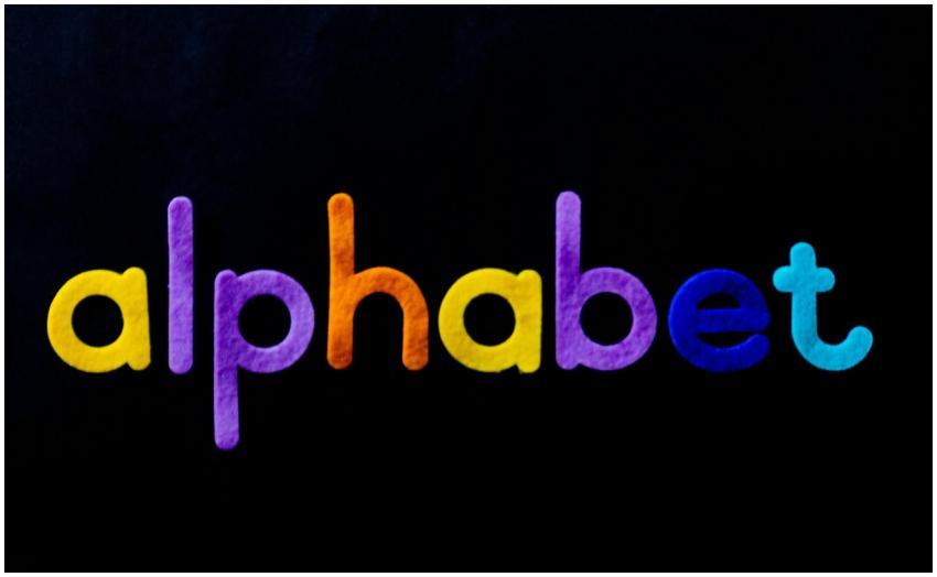 Vivid colorful alphabet letters on a black backgro