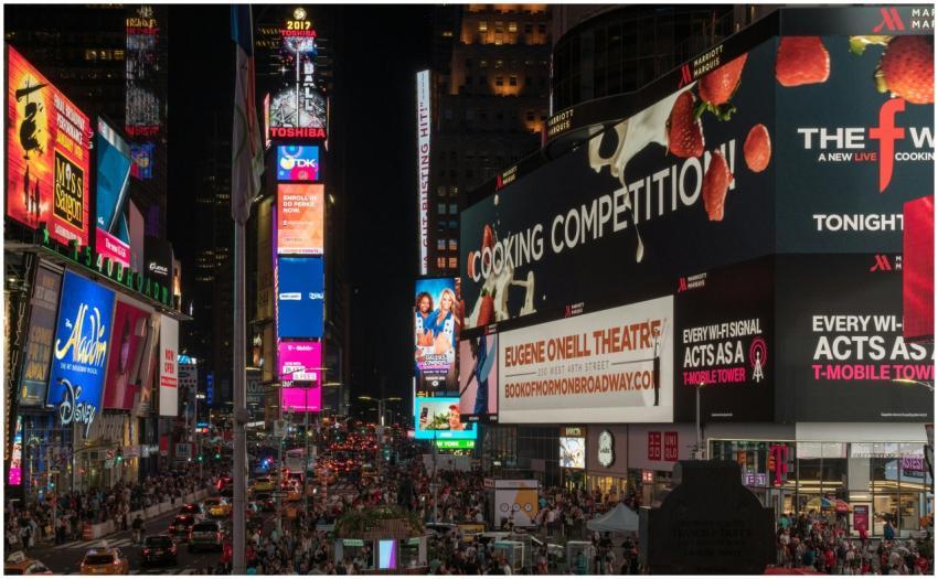 Times Square buzzing with nightlife, neon signs, a