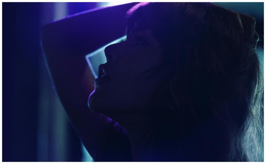 Silhouetted woman with dramatic lighting creates a