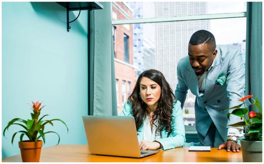 Two colleagues work together in a modern office se