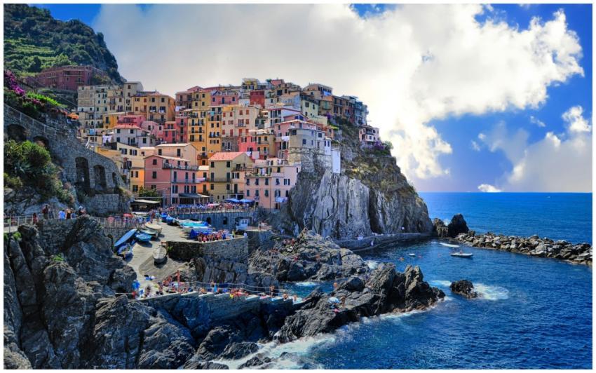 Vibrant houses perched on cliffs overlooking the s