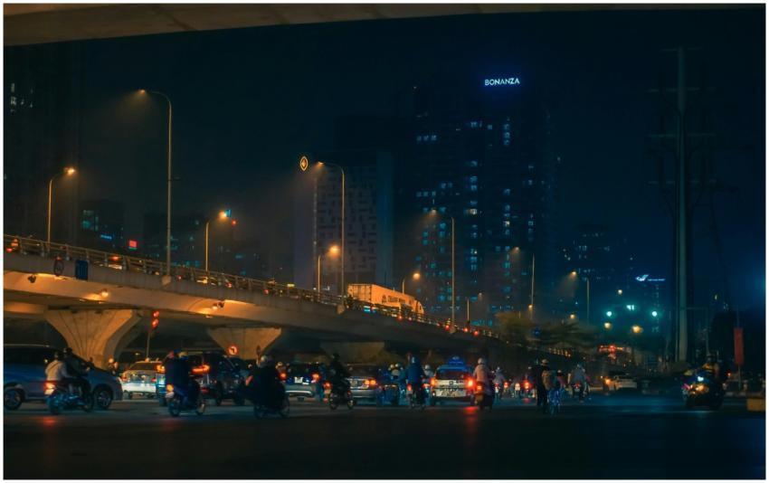 Street view of night traffic under citylights in H