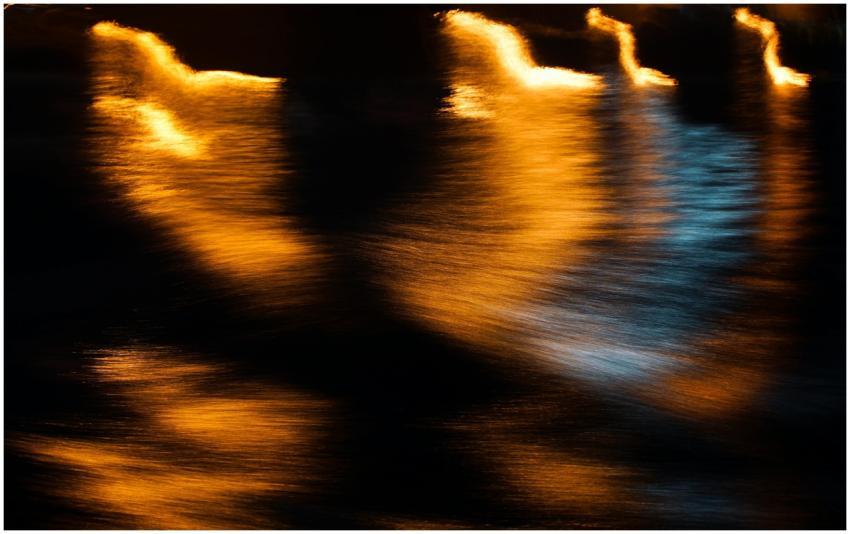 Abstract photo of water reflections with golden li