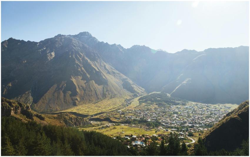 Aerial Mountain Village Sunlight