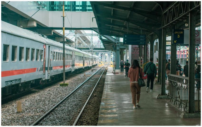 Commuters walking on a busy train station platform