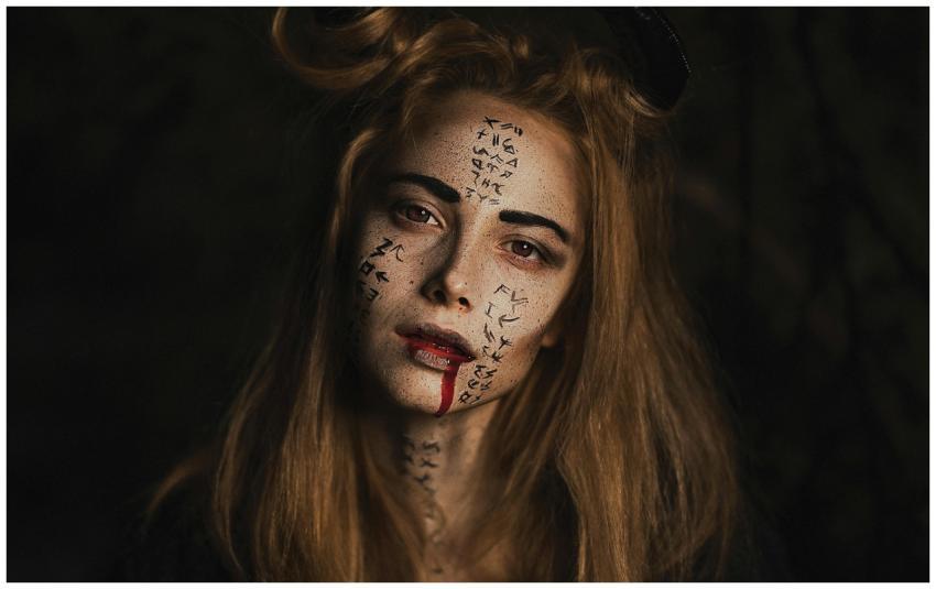 Eerie portrait of a woman with intricate face pain