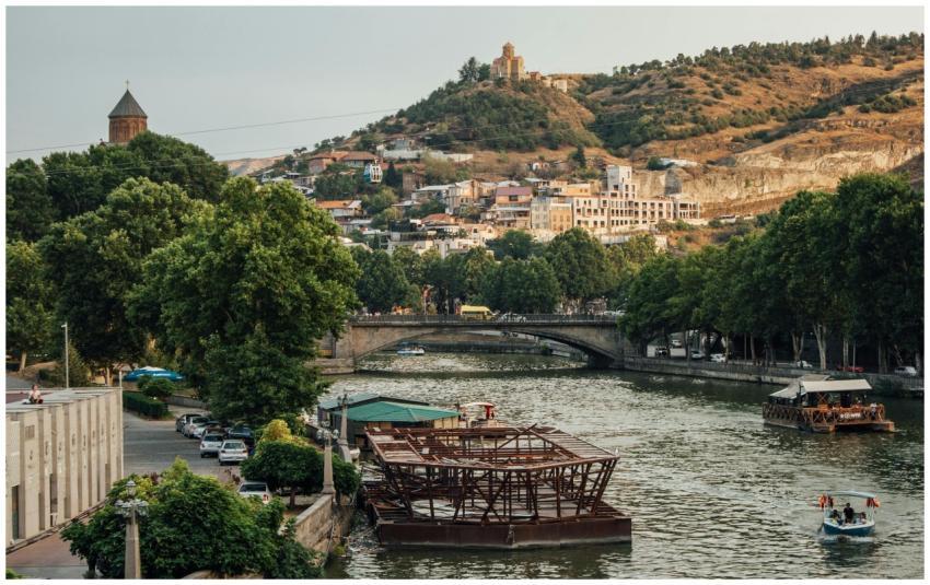 Picturesque view of Tbilisi with river and hills,